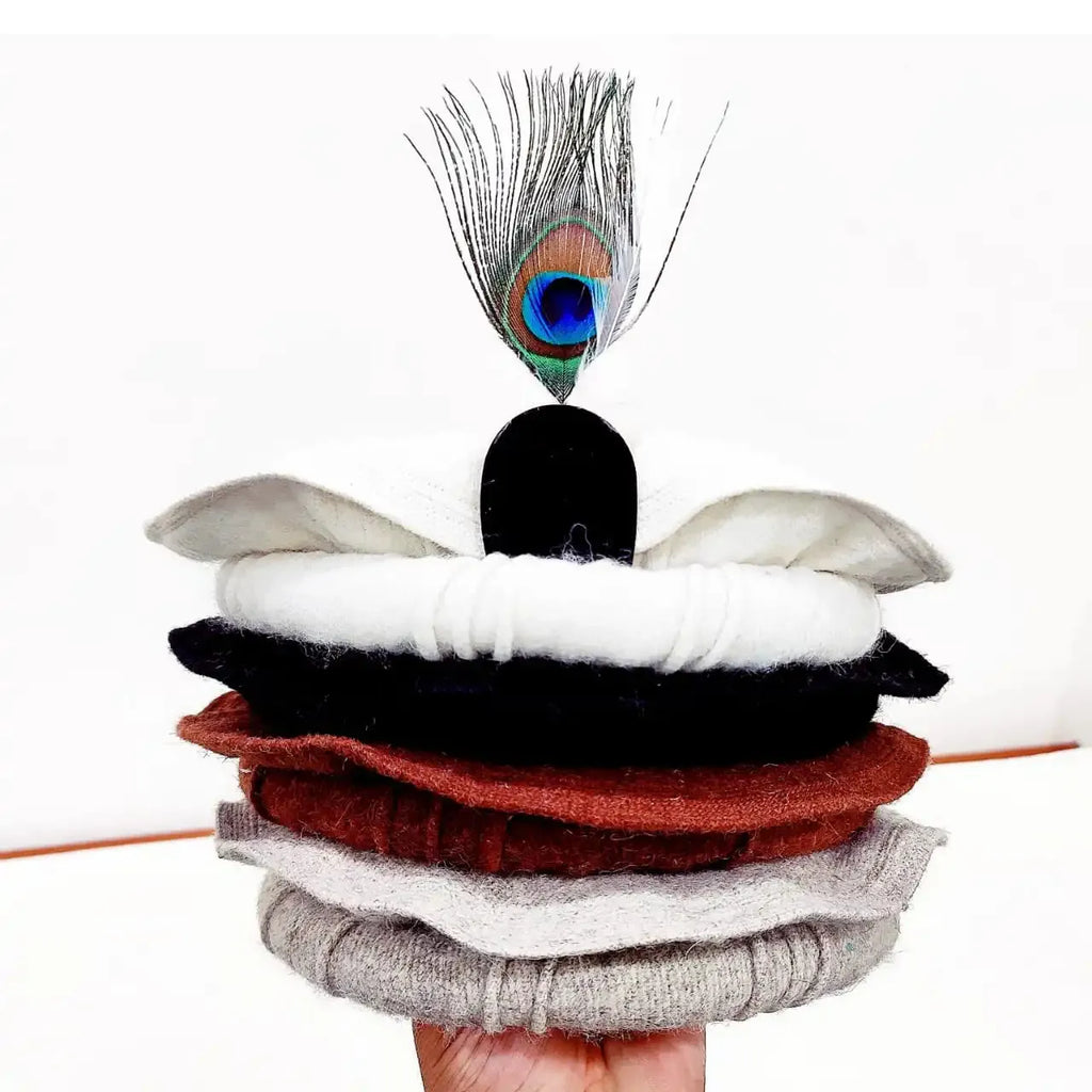 Elegant White Chitrali Pakool with Feather Accent