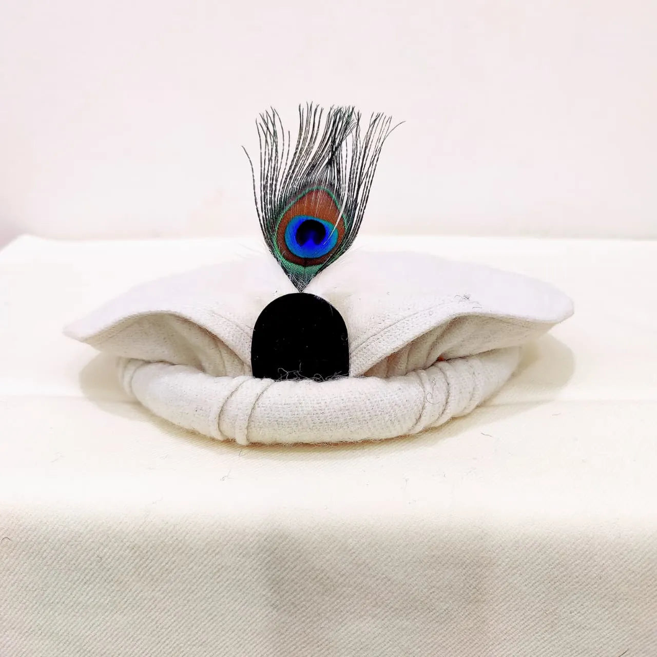 Elegant White Chitrali Pakool with Feather Accent