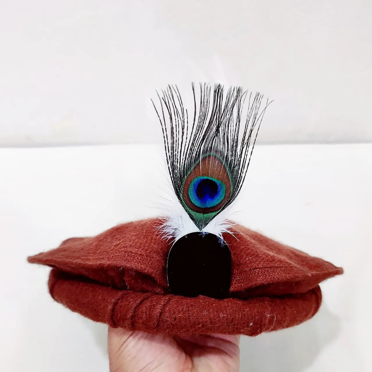 Elegant Rust Chitrali Woolen Pakool with Peacock Feather