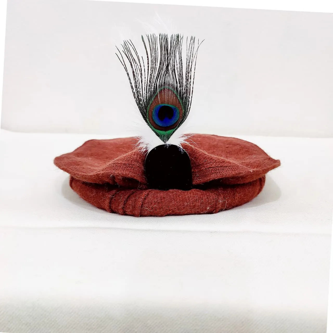 Elegant Rust Chitrali Woolen Pakool with Peacock Feather